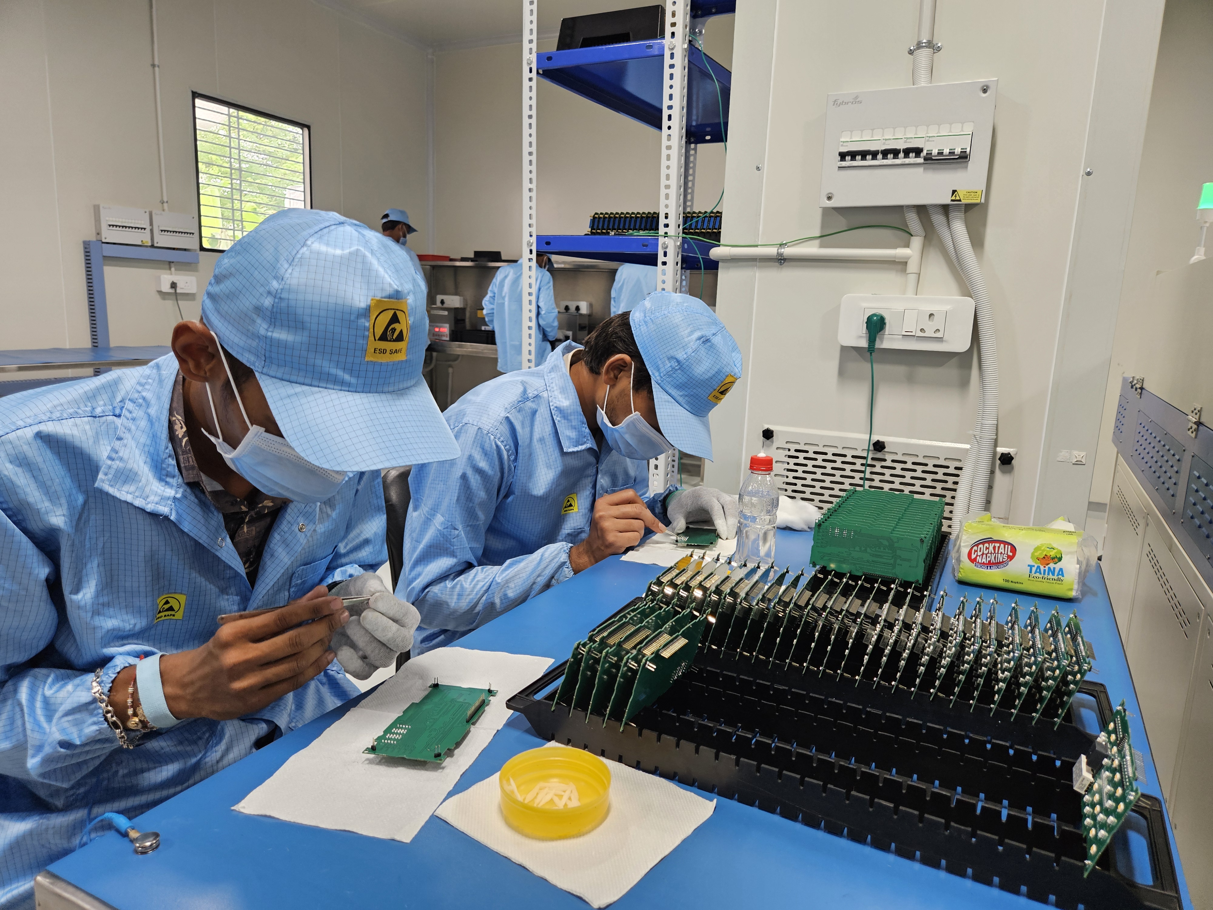 SMT pick and place robotic arm on the assembly line